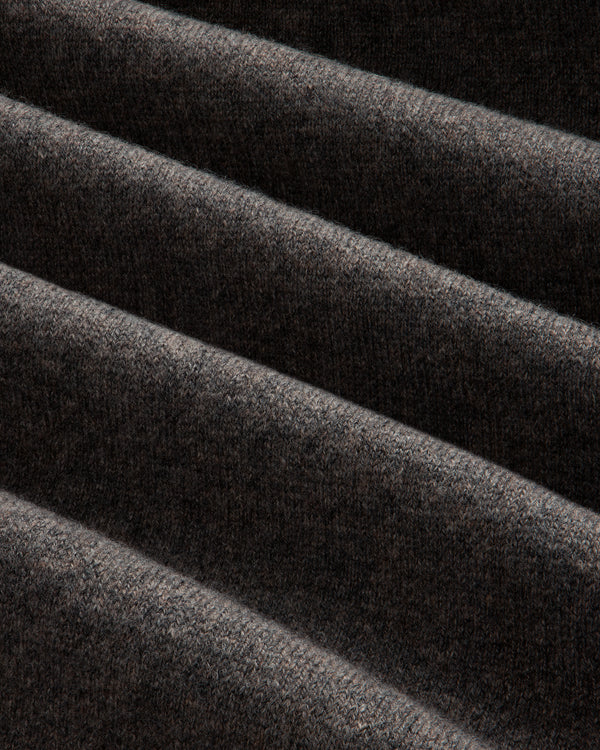 Close-up of the Full-Zip Pavilion Cashmere Hoodie’s dark brown ribbed fabric with soft, visible texture and gentle folds.