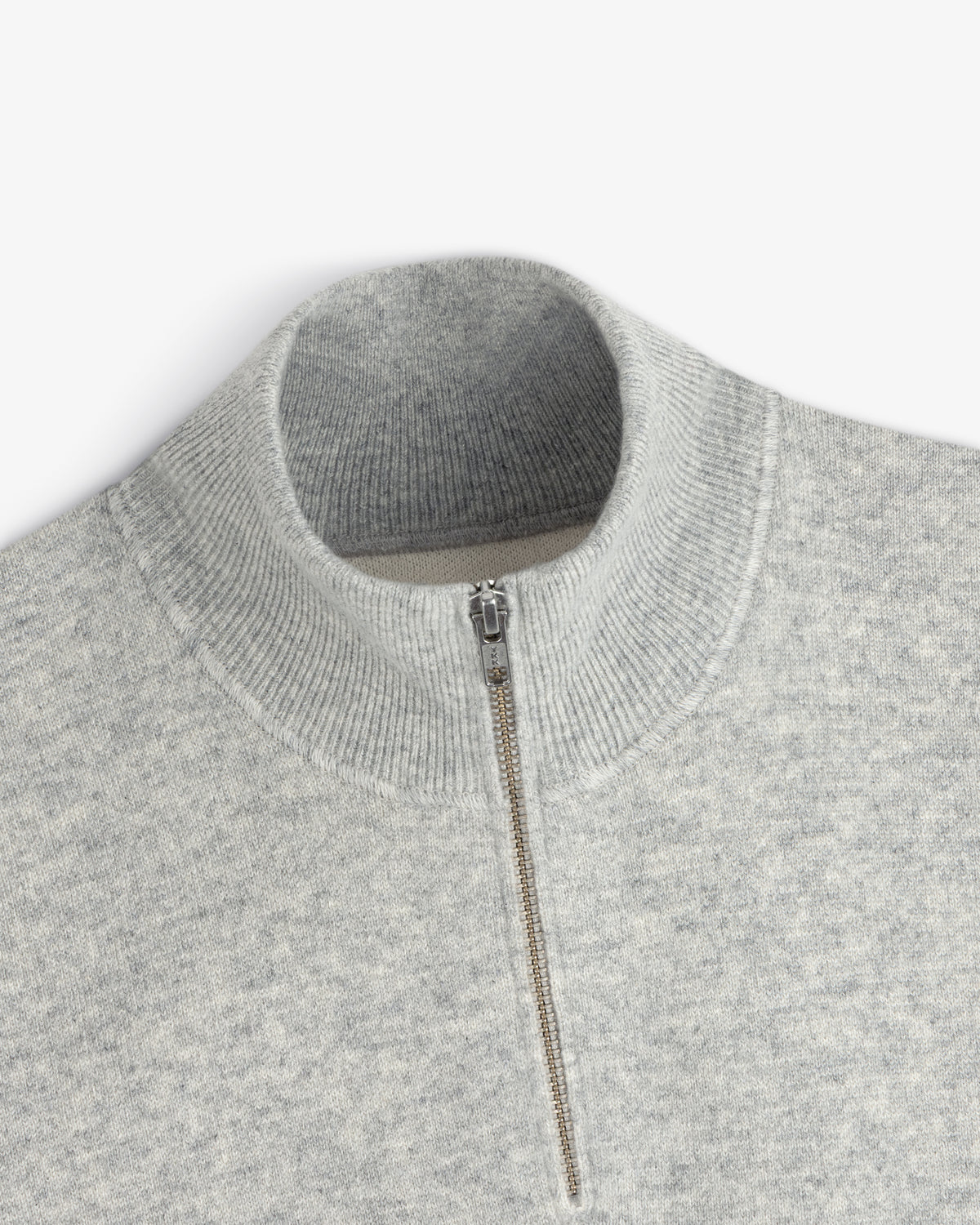 Quarter Zip Pavilion Cashmere Pullover in light gray with ribbed mock neck, shown from a top view.