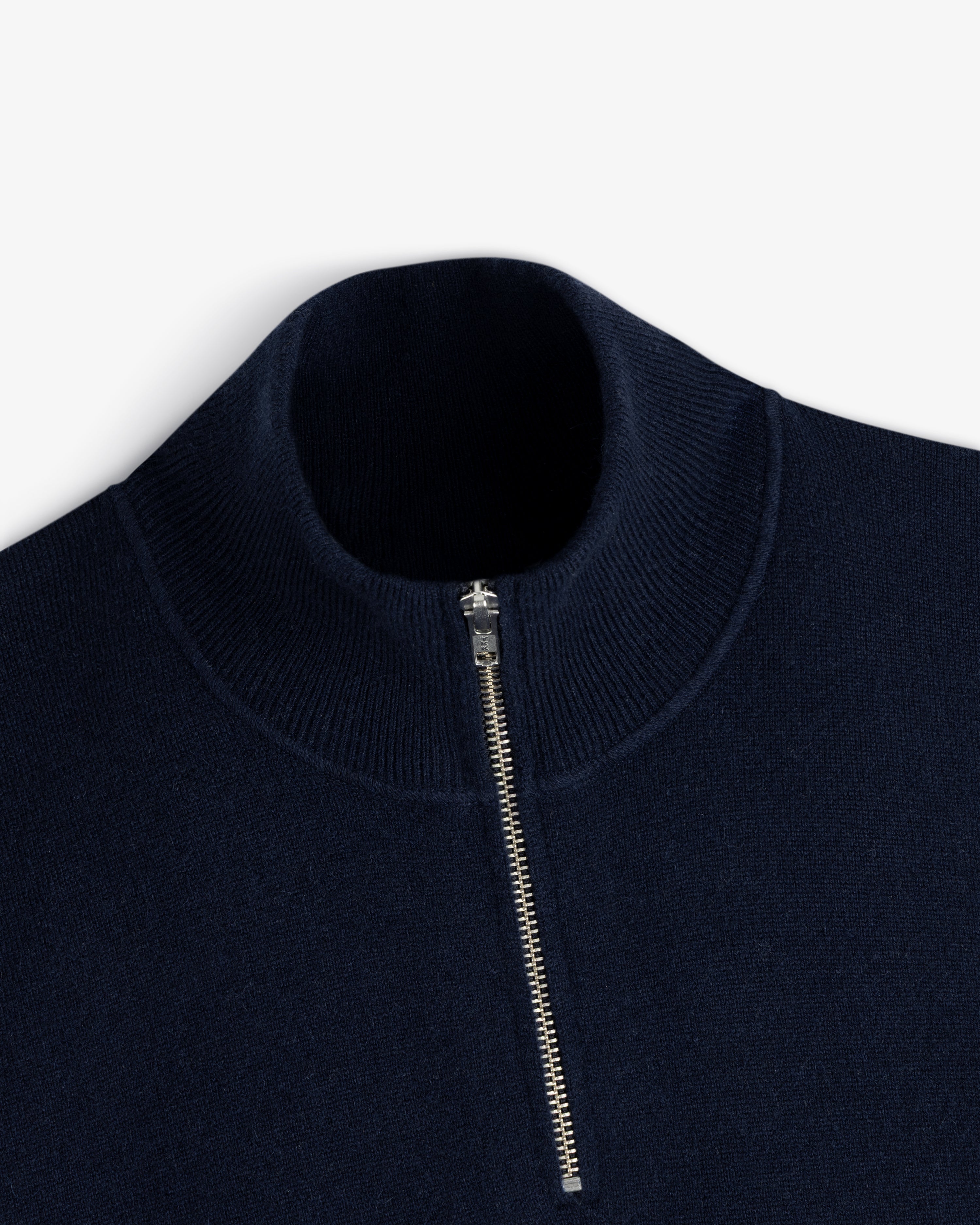 Quarter Zip Pavilion Cashmere Pullover in navy with silver zip and ribbed mock neck, shown on white background.