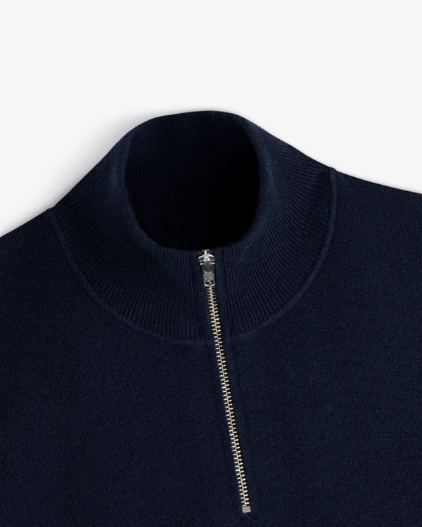 Quarter Zip Pavilion Cashmere Pullover in navy with silver zip and ribbed mock neck, shown on white background.