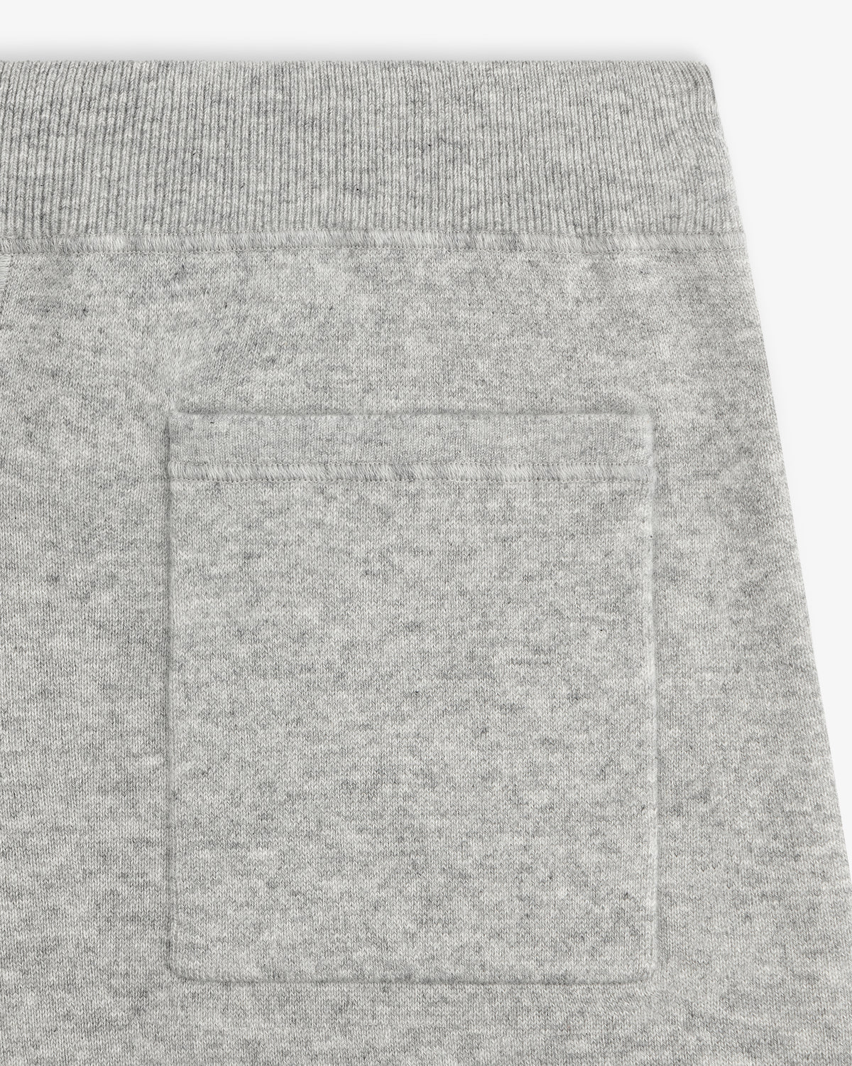 Close-up of Pavilion Cashmere Sweatpant pocket with ribbed elastic waistband, highlighting the soft fabric texture.