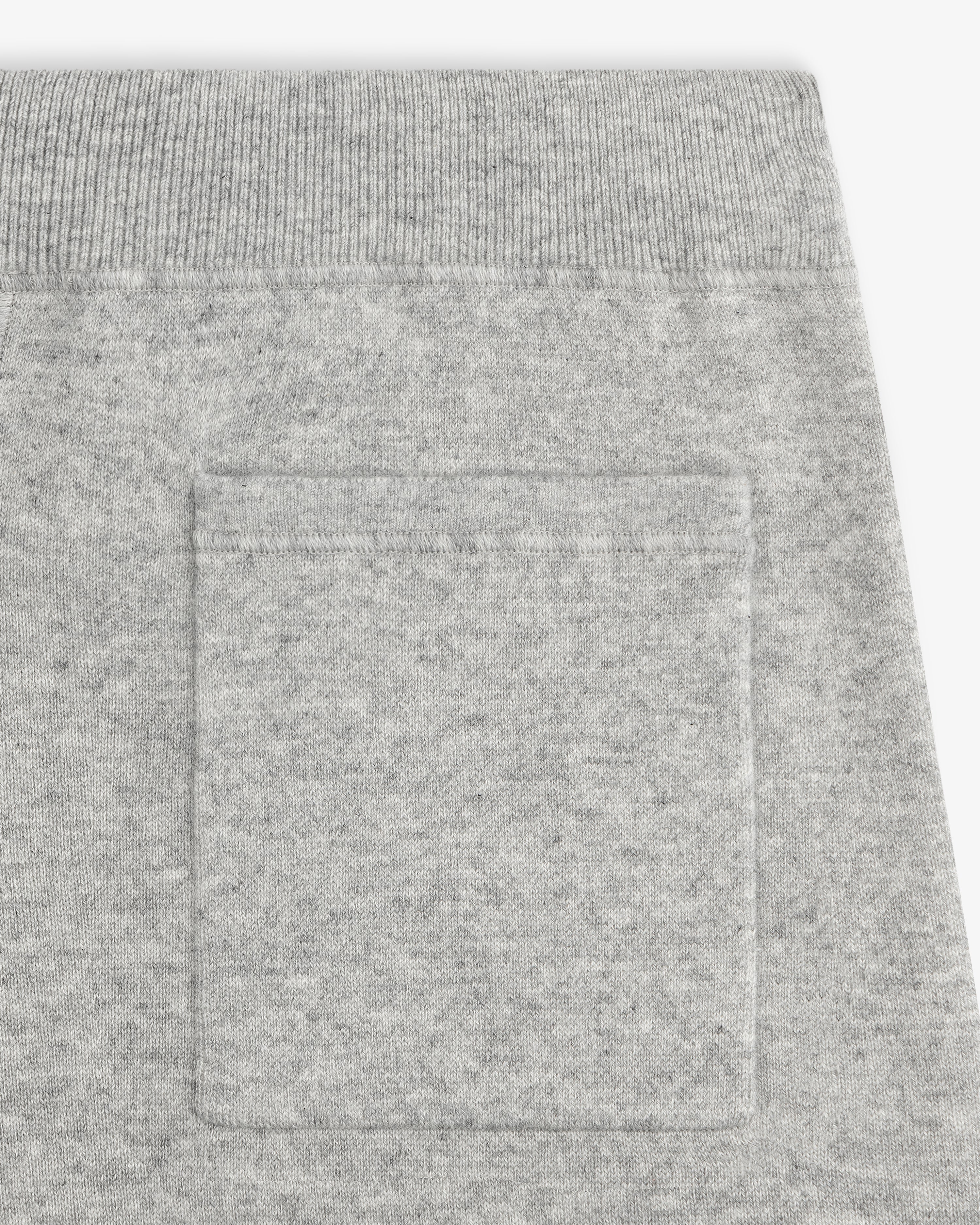 Close-up of Pavilion Cashmere Sweatpant pocket with ribbed elastic waistband, highlighting the soft fabric texture.