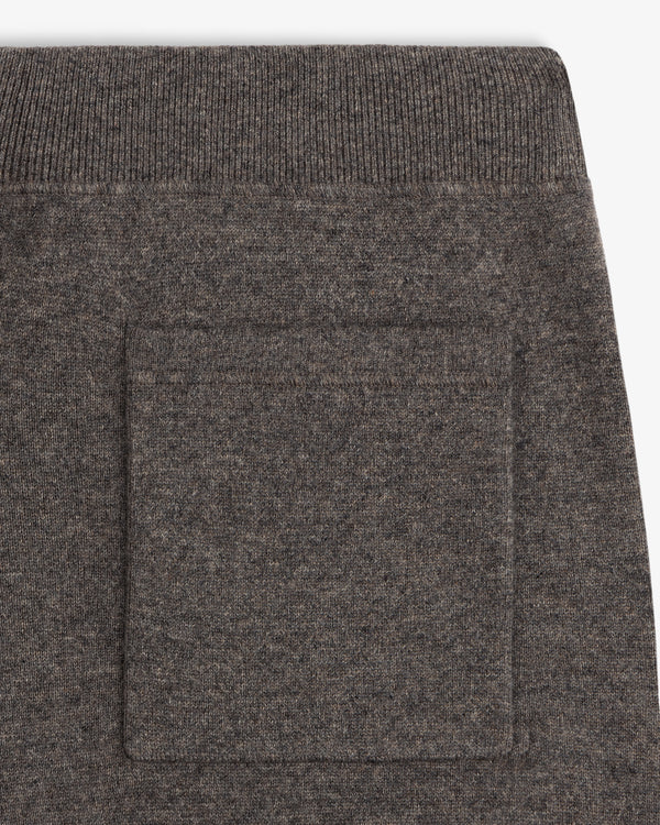 Close-up of a Pavilion Cashmere Sweatpant showing brown knit pocket detail and ribbed waistband above.