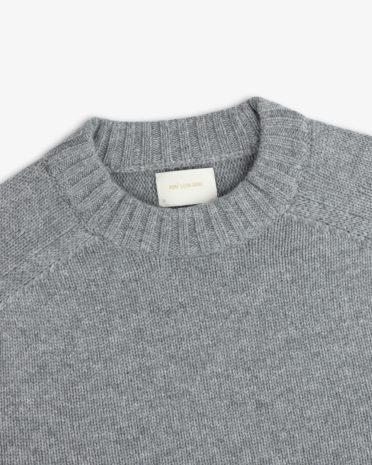 Grey Cashmere Crewneck Sweater with a ribbed collar and an interior brand label.