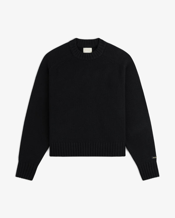 Black Cashmere Crewneck sweater with a long-sleeve design and a ribbed hem and cuffs.