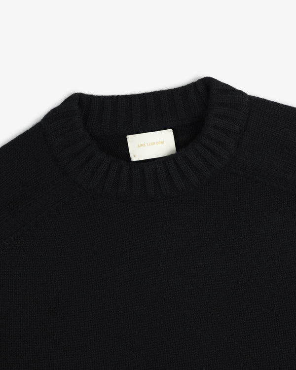 Black Cashmere Crewneck Sweater with a ribbed collar and an interior brand label.
