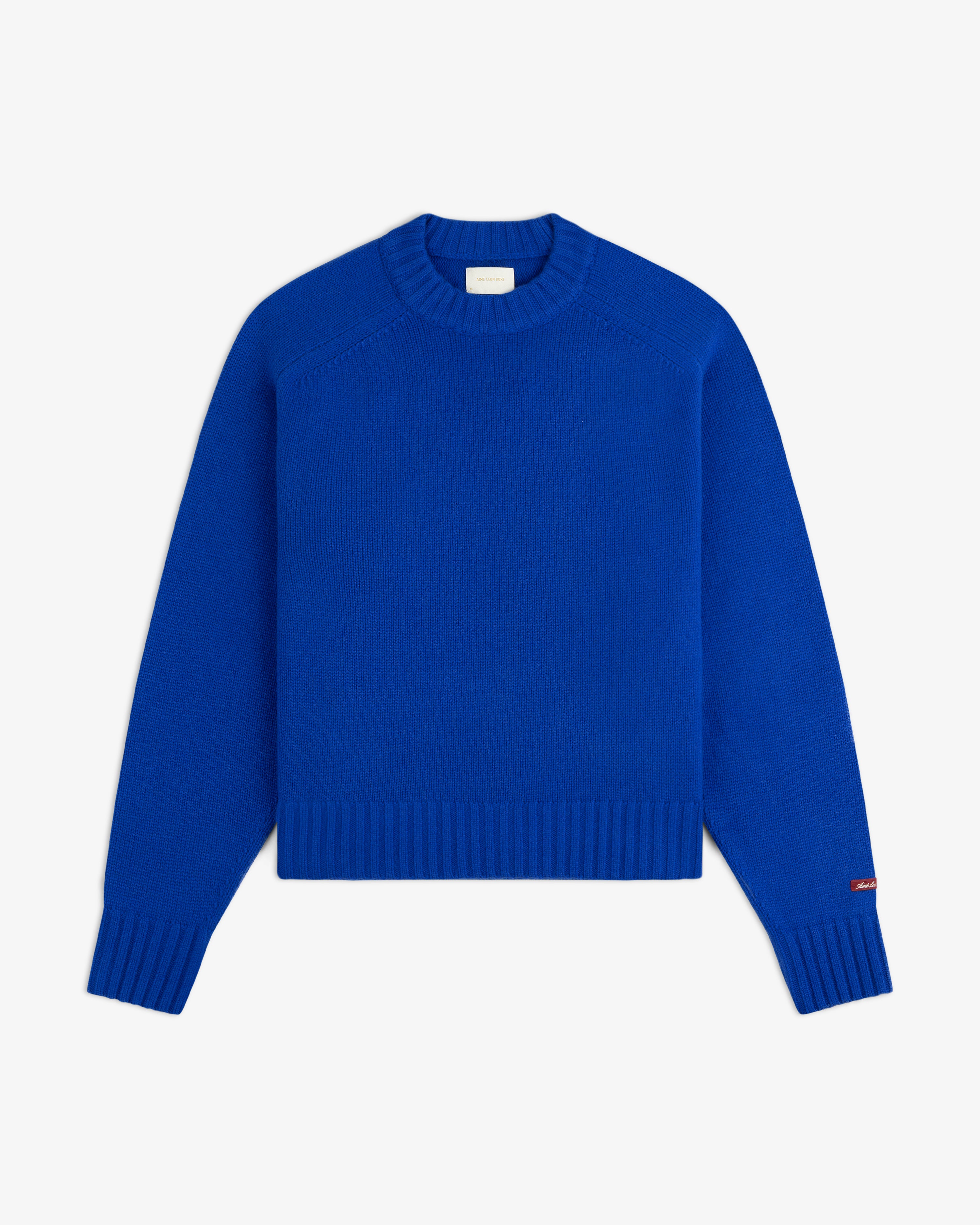 Bright blue Cashmere Crewneck Sweater with long sleeves and ribbed cuffs and hem.