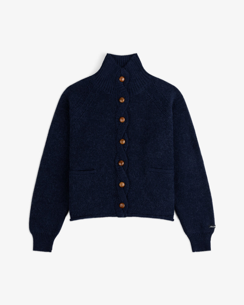 Twisted Rib Cardigan, a navy blue mock-neck piece with a ribbed texture, front pockets, and brown buttons.
