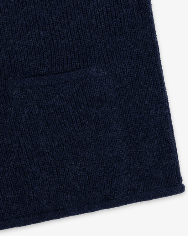 Close-up of navy blue knit fabric on a Twisted Rib Cardigan featuring a horizontal pocket seam.