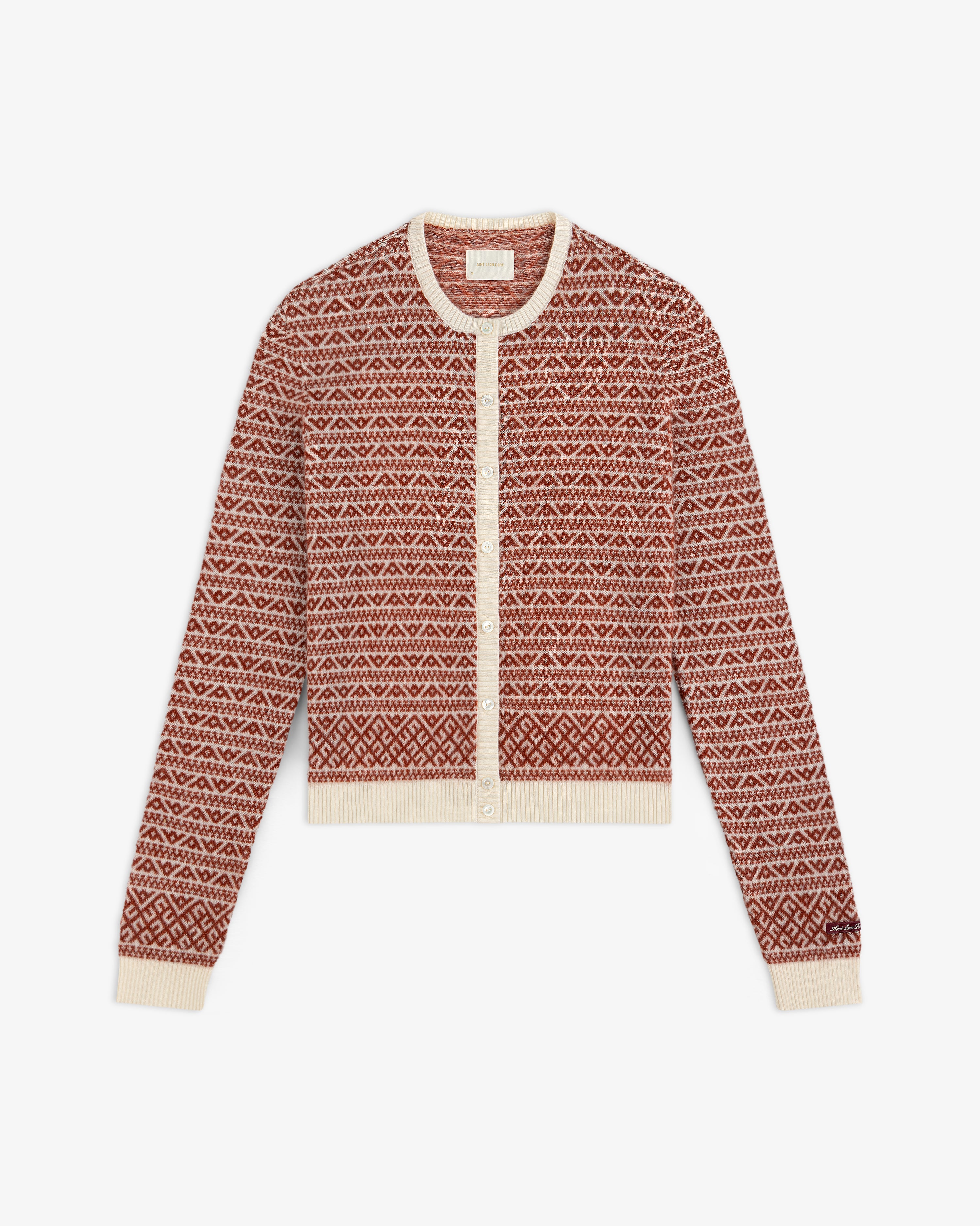 Wool Cashmere Jacquard Cardigan in a rust and cream geometric pattern with a button-front closure and ribbed trim.