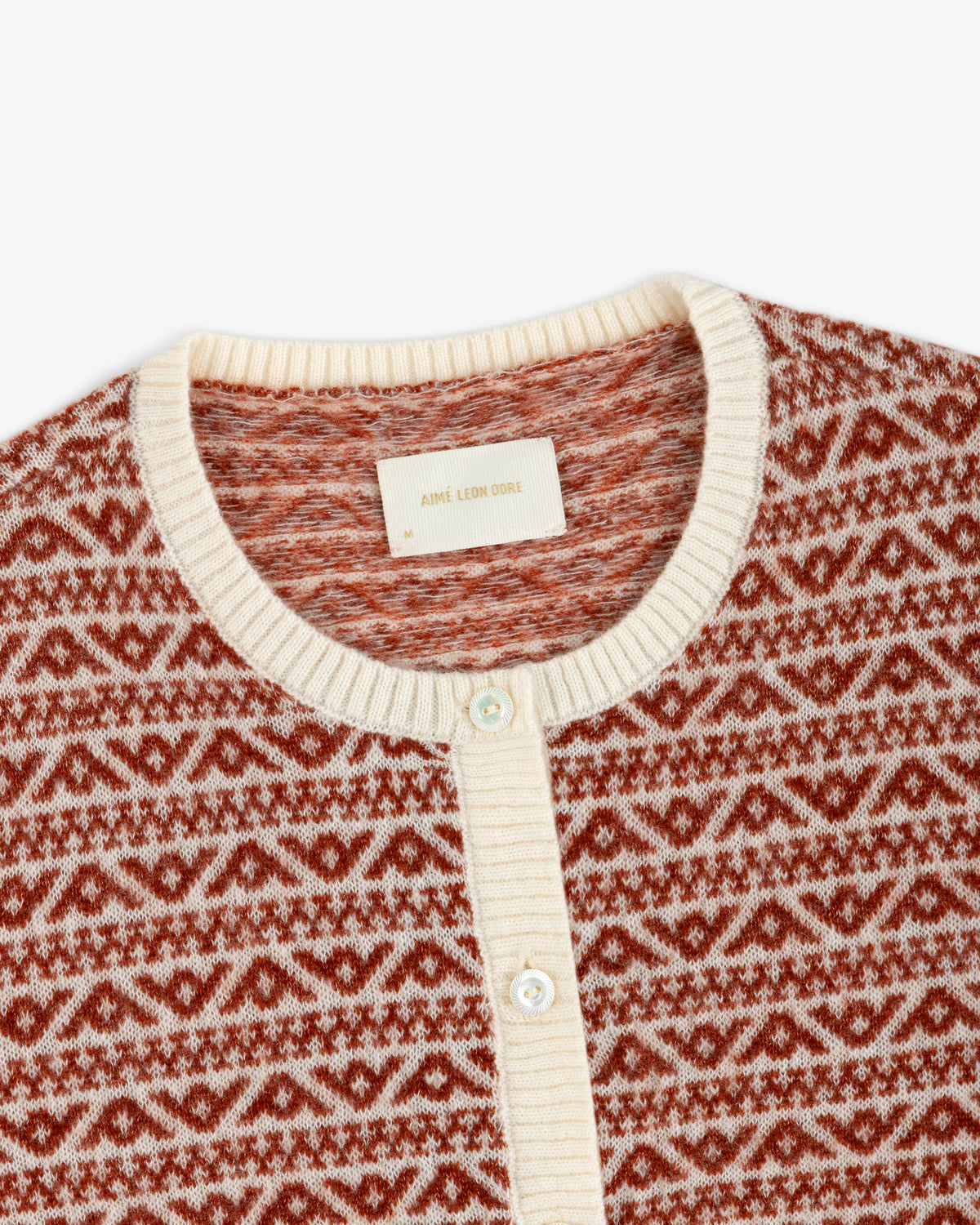 Wool Cashmere Jacquard Cardigan in a red and cream geometric print with a button front and ribbed trim.