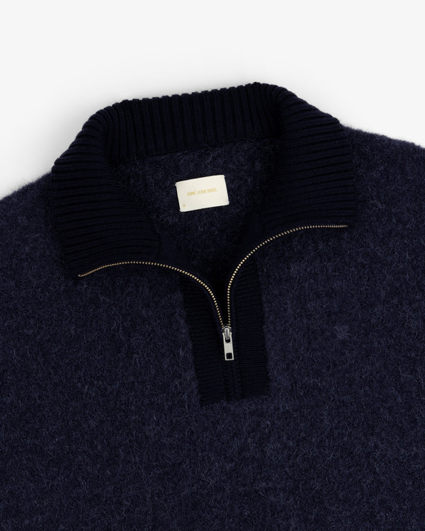 Alpaca Wool Quarter Zip Sweater in navy with ribbed collar and visible zip, shown flat on a white background.