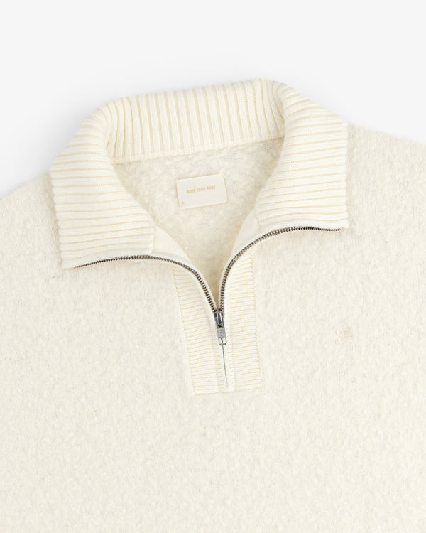 Alpaca Wool Quarter Zip Sweater in cream, featuring a ribbed stand collar and half-zip, shown on white background.
