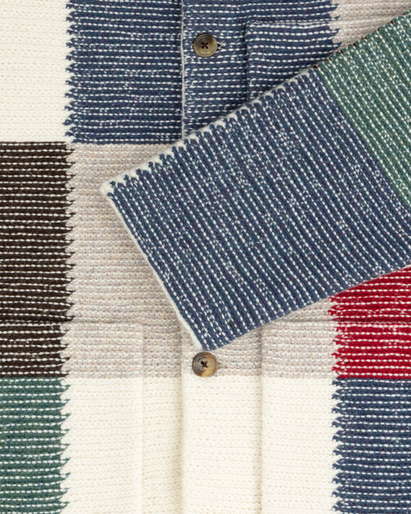 Patchwork Knit Chore Jacket featuring a buttoned design made of multicolored, textured knit fabric blocks.