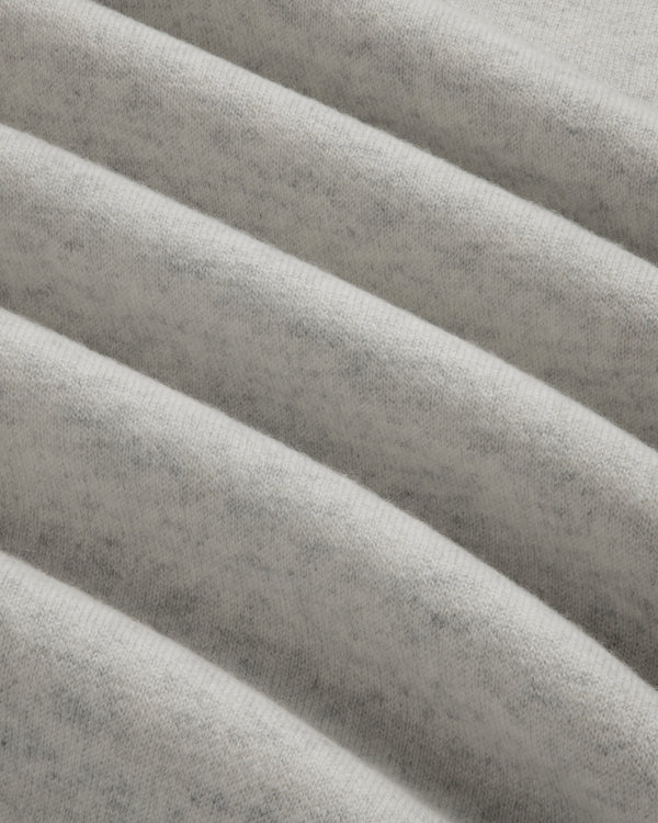 Close-up of light gray Pavilion Cashmere Crewneck Sweatshirt with ribbed, soft fabric and subtle, fuzzy texture.