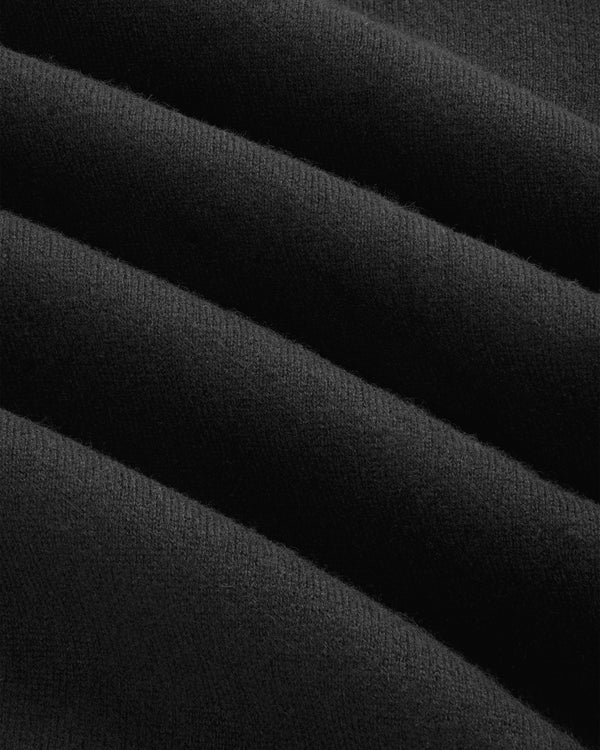 Close-up of Pavilion Cashmere Crewneck Sweatshirt, black fabric with visible texture and soft diagonal lines.