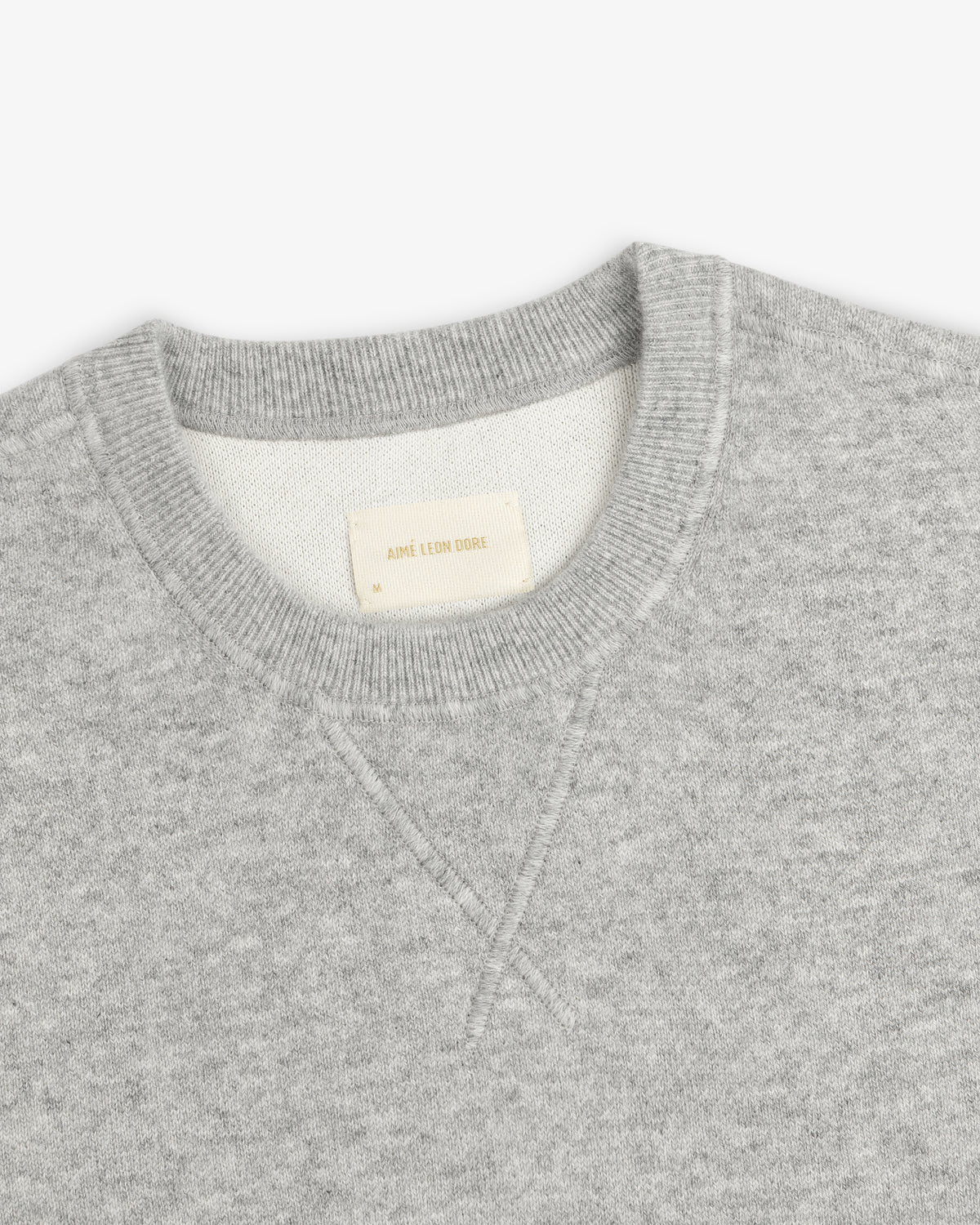 Pavilion Cashmere Crewneck Sweatshirt with ribbed collar, AIMÉ LEON DORE label, shown on a white background.