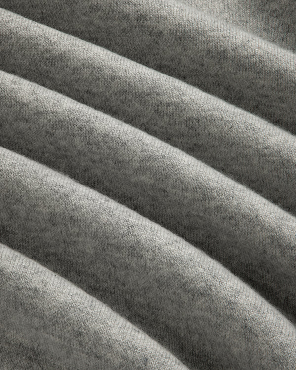 Close-up of Pavilion Cashmere Crewneck Sweatshirt in grey, showing its soft ribbed fabric and horizontal texture.