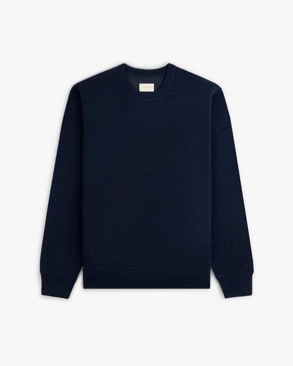 Pavilion Cashmere Crewneck Sweatshirt in navy blue, flat on white, with long sleeves and ribbed cuffs visible.
