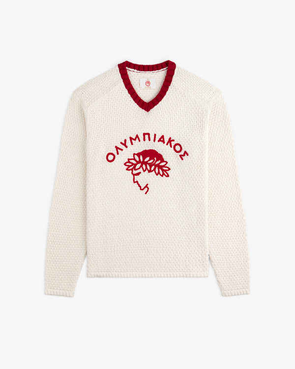 Cream-colored ALD / Olympiacos F.C. Knit V-Neck Sweater with a red collar and a red graphic of a laurel-wreathed head.
