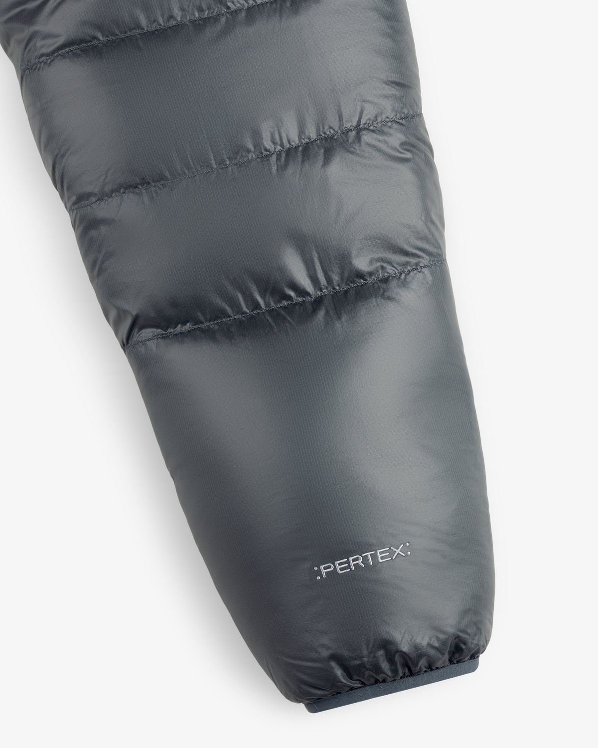 Close-up of ALD/The North Face Reversible Pertex® Nuptse Jacket sleeve with Pertex® logo by the cuff.