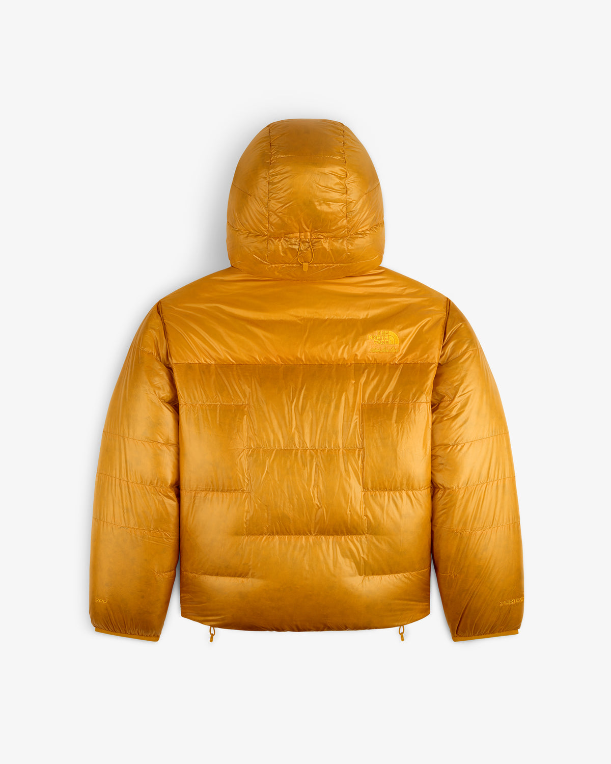 The ALD/The North Face Reversible Pertex® Nuptse Jacket in mustard yellow, hooded, shown from the back on white.