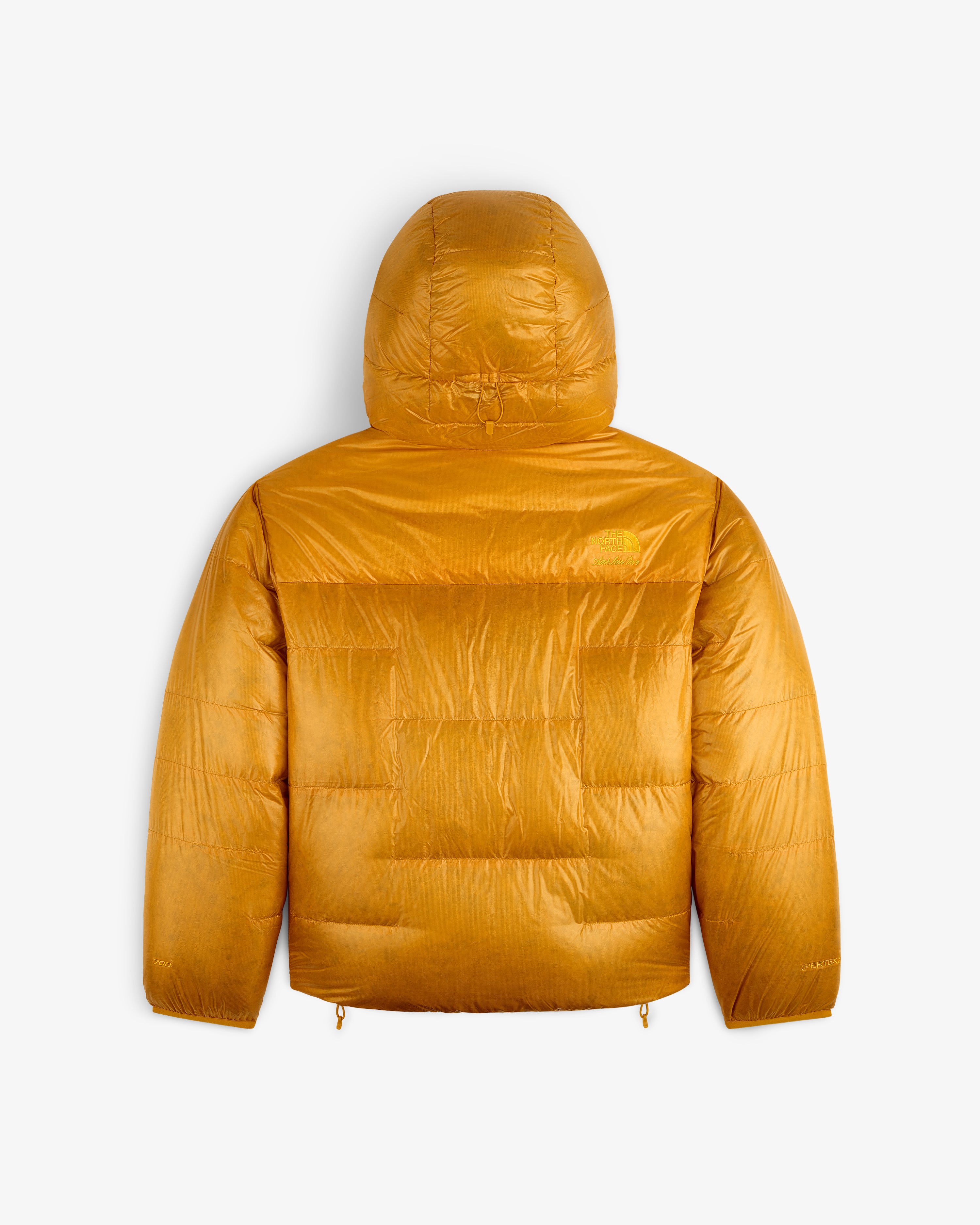 The ALD/The North Face Reversible Pertex® Nuptse Jacket in mustard yellow, hooded, shown from the back on white.