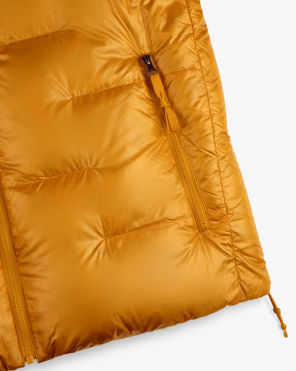 Close-up of ALD/The North Face Reversible Pertex® Nuptse Jacket with zip pocket and visible stitching.