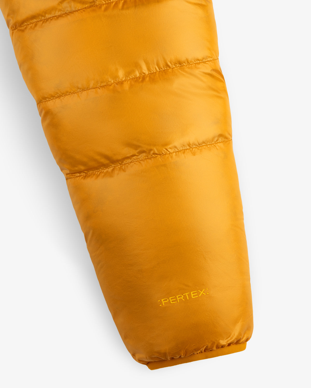 Close-up of ALD/The North Face Reversible Pertex® Nuptse Jacket sleeve with “PERTEX” near the cuff.