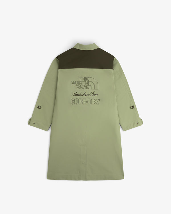 ALD/The North Face GORE-TEX Trench: long sage green coat, dark green shoulders, logos on back, sleeves rolled up.