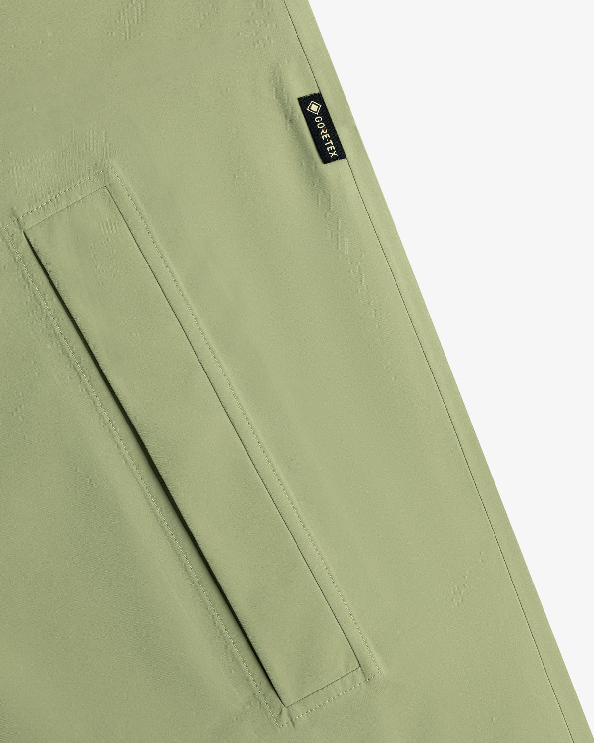Light green ALD/The North Face GORE-TEX Trench Coat with diagonal pocket and small black GORE-TEX seam tag.