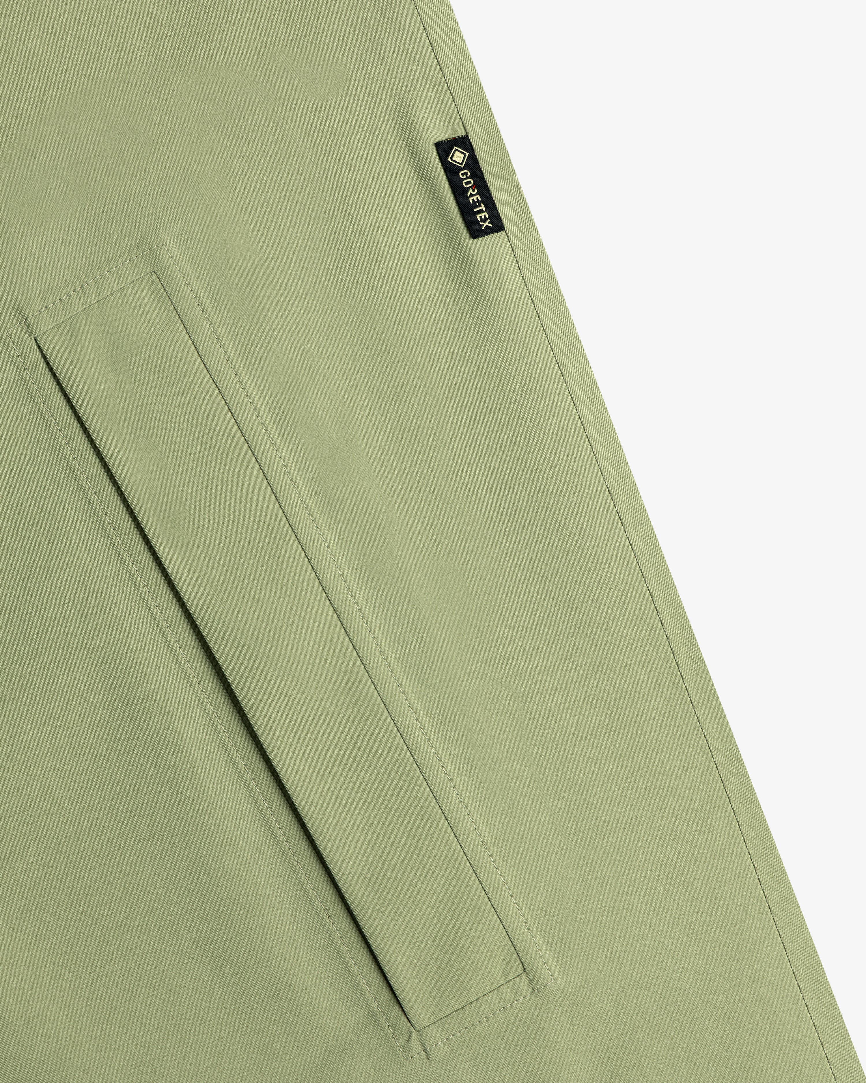 Light green ALD/The North Face GORE-TEX Trench Coat with diagonal pocket and small black GORE-TEX seam tag.