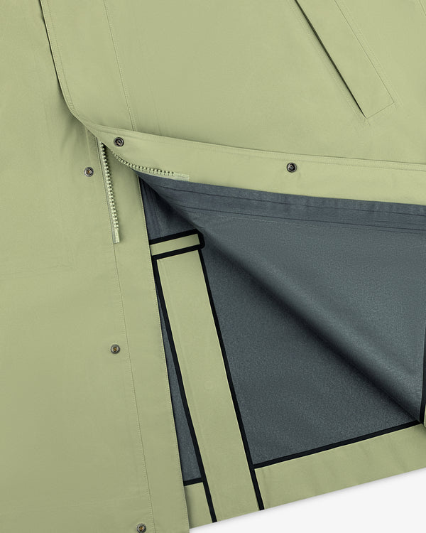 Close-up of the ALD / The North Face GORE-TEX Trench Coat, light green with snap buttons, grey lining, black seam tape.