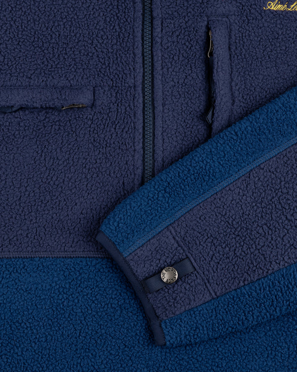 Close-up of the ALD/The North Face ’95 Denali Half-Zip Fleece Pullover, highlighting zipper pocket and sleeve button.