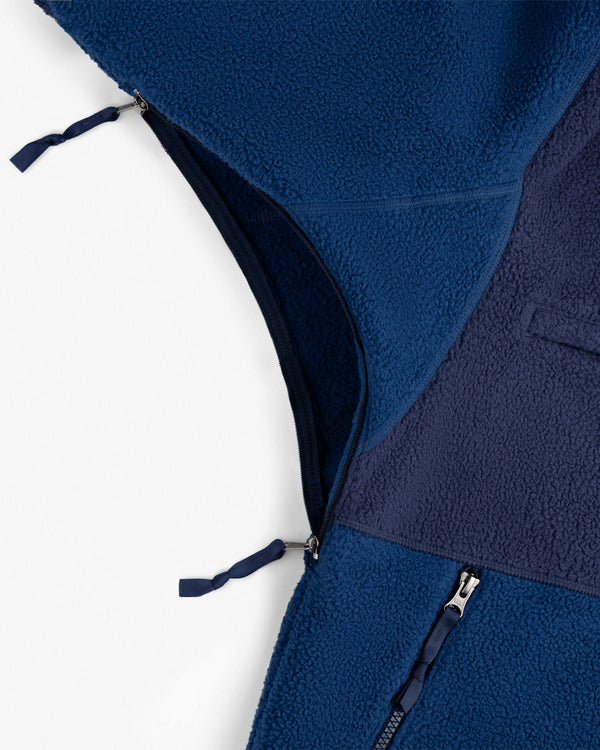 Close-up of ALD / The North Face ’95 Denali Half-Zip Fleece Pullover, highlighting zippers and textured blue fleece.