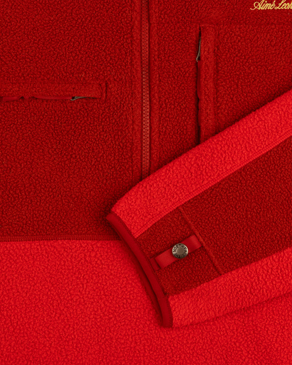 Close-up of the ALD/The North Face ’95 Denali Half-Zip Fleece Pullover showing a pocket, zipper, and snap cuff.