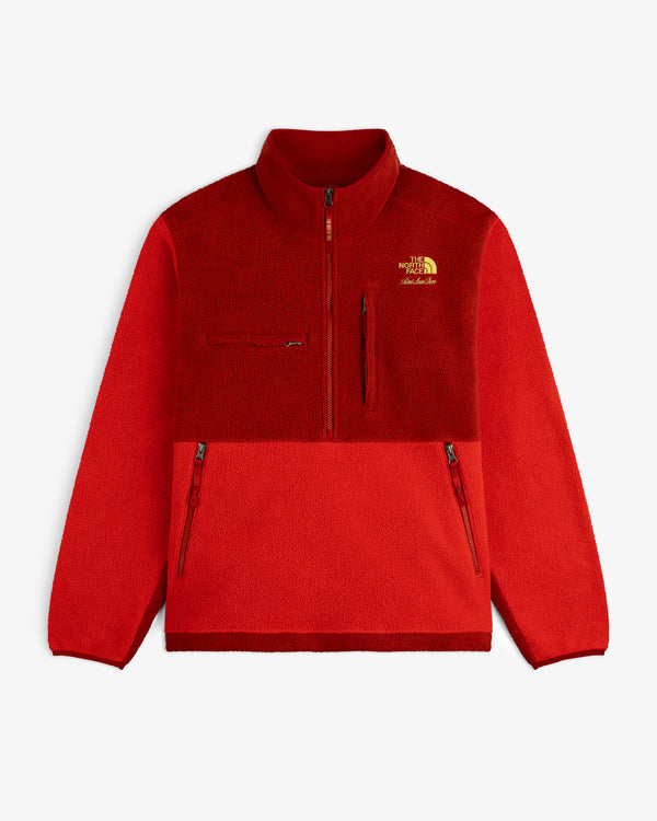 This is a red ALD/The North Face ’95 Denali Half-Zip Fleece Pullover with zip pockets and left chest logo.