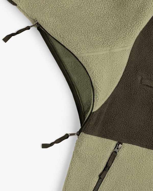 Close-up of ALD / The North Face ’95 Denali Half-Zip Fleece Pullover with olive and dark brown textures, plus zippers.