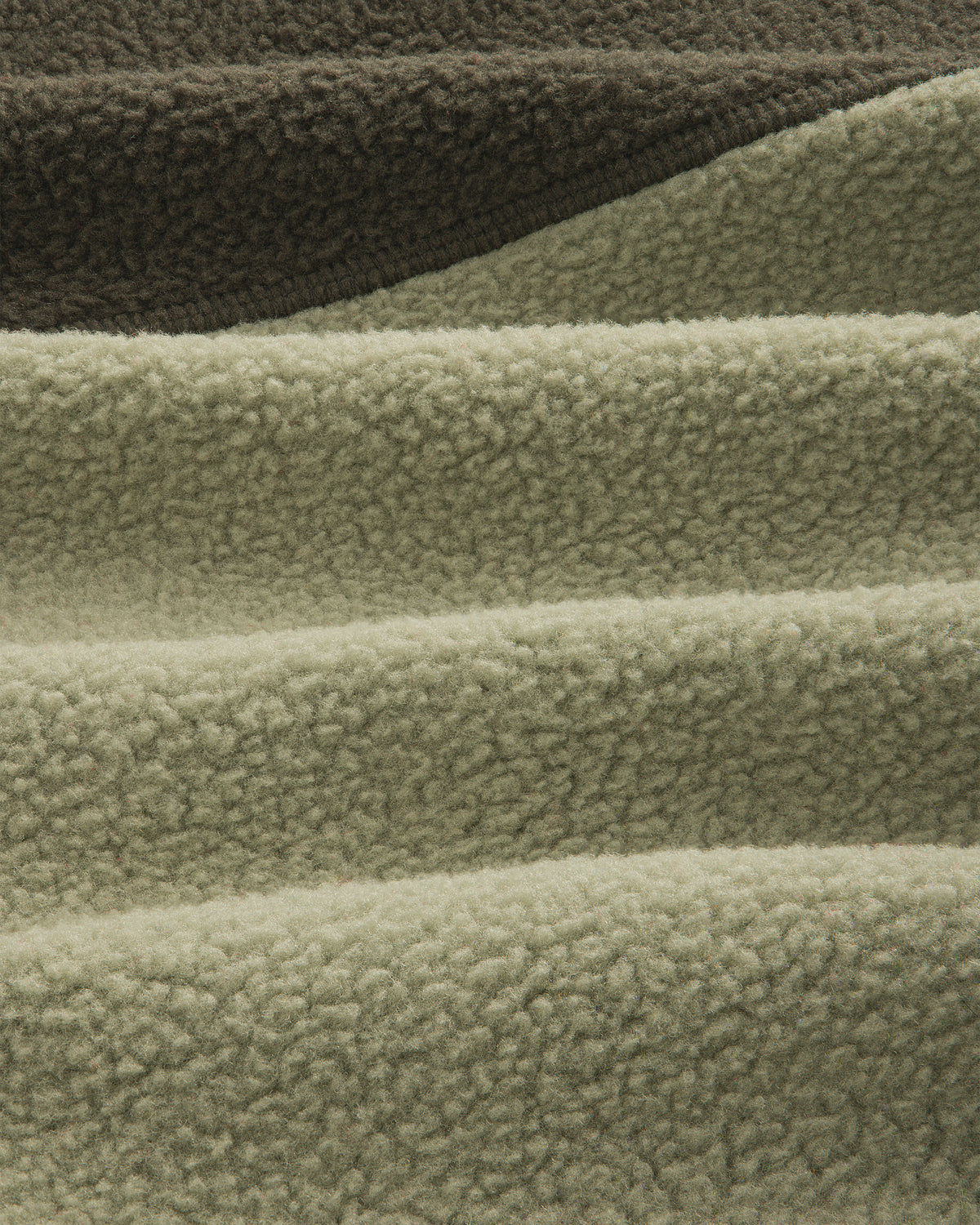 Detail of ALD / The North Face ’95 Denali Half-Zip Fleece Pullover in olive and sage green textured fleece.