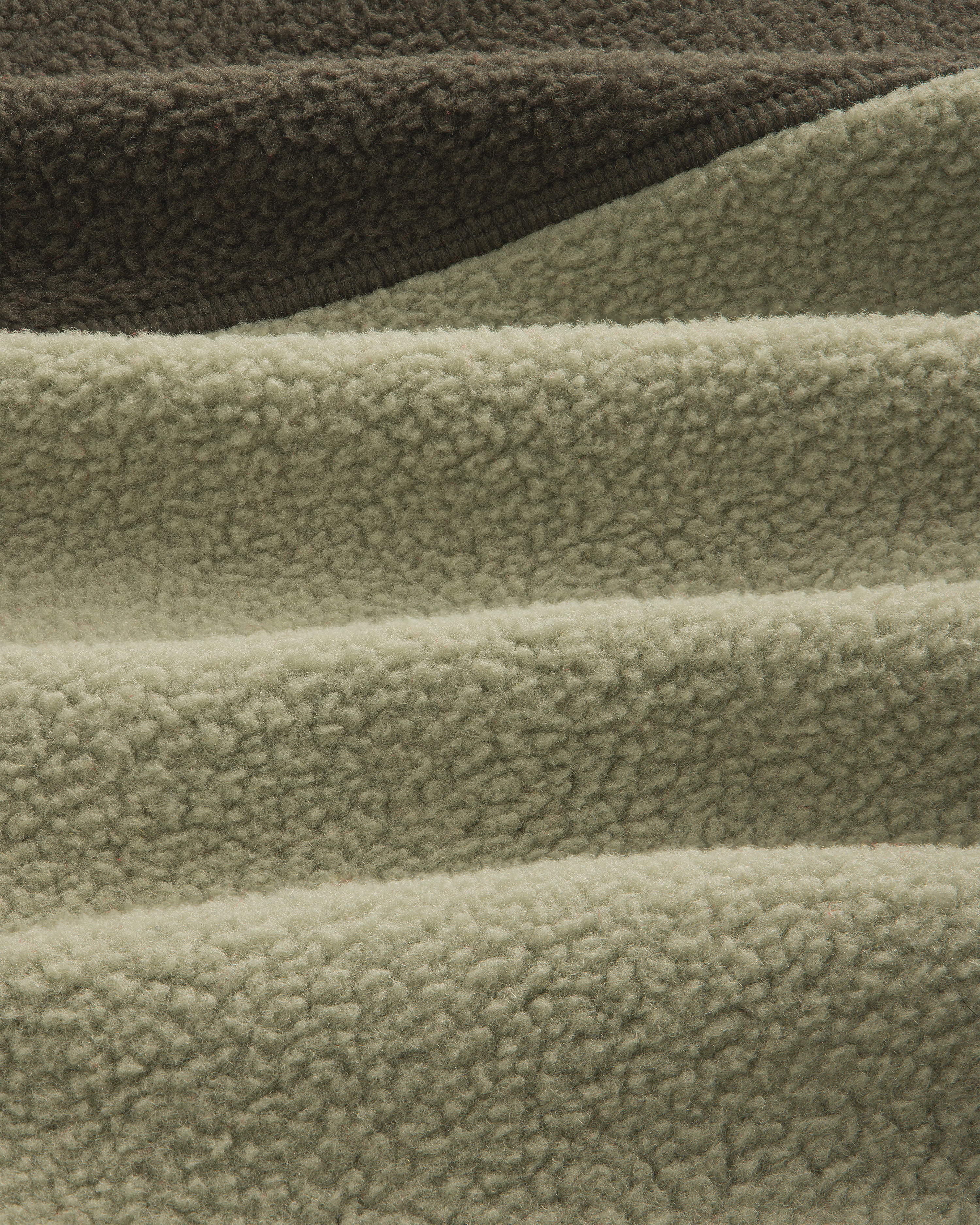 Detail of ALD / The North Face ’95 Denali Half-Zip Fleece Pullover in olive and sage green textured fleece.