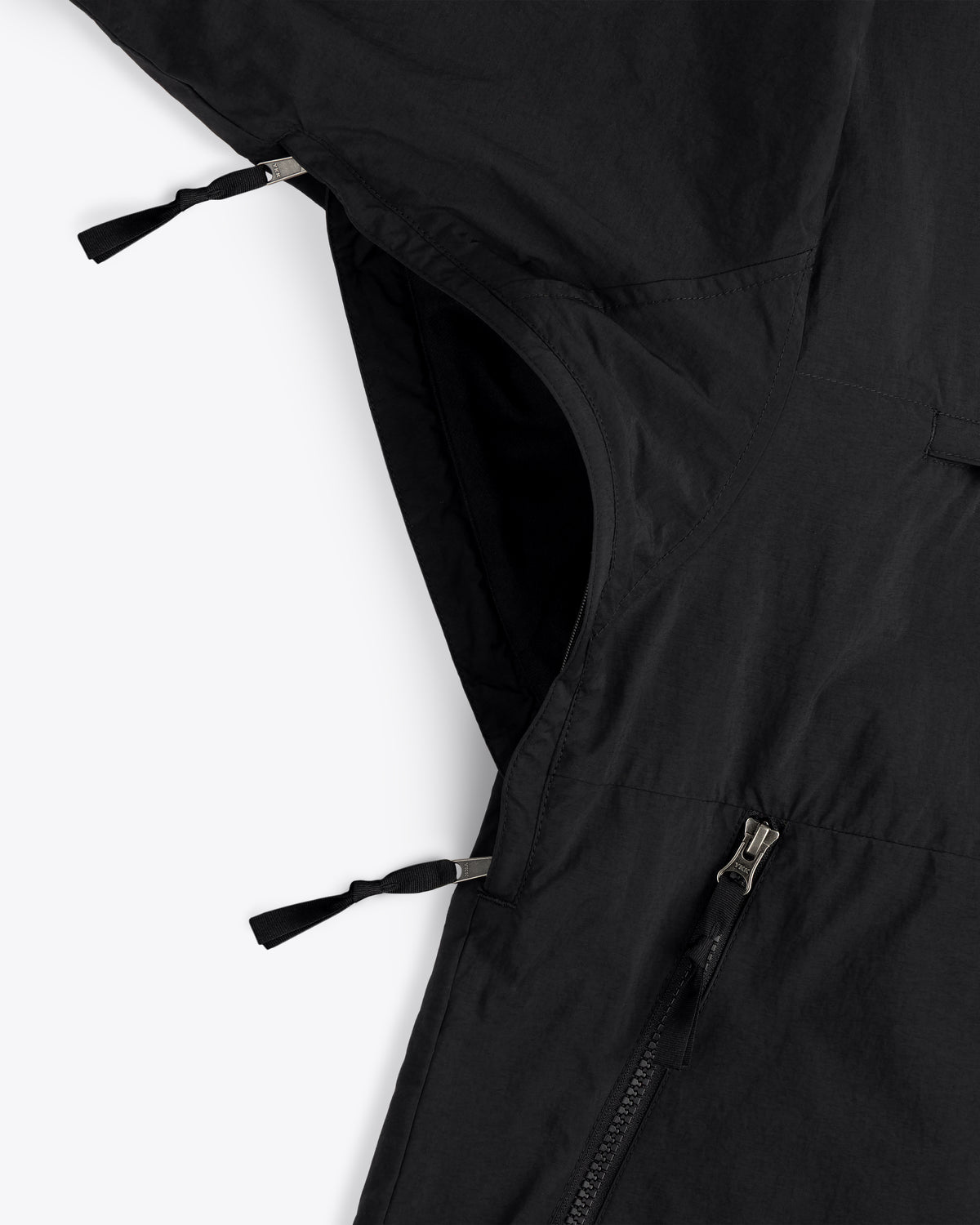 Close-up of ALD / The North Face Nylon Denali Jacket, black with two zippers, one partially open, on white background.