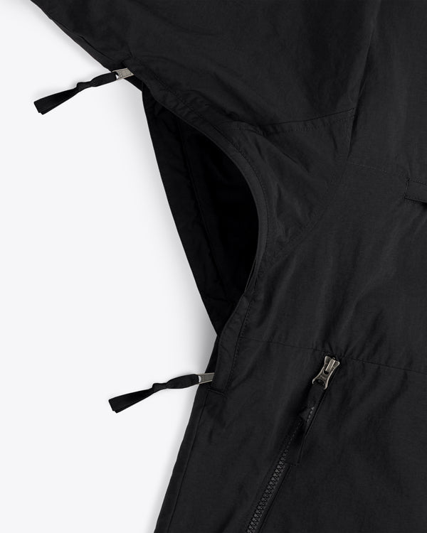 Close-up of ALD / The North Face Nylon Denali Jacket, black with two zippers, one partially open, on white background.