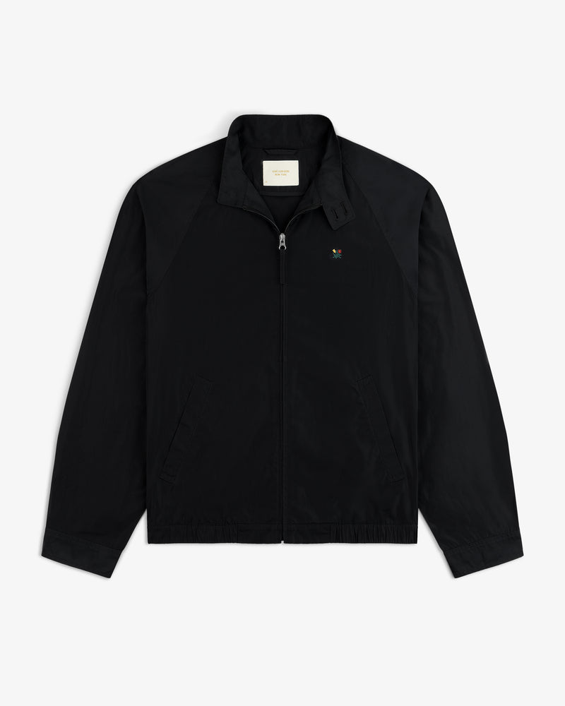 Crest Nylon Windbreaker: black zip-up with collar, two side pockets, and a small chest logo.