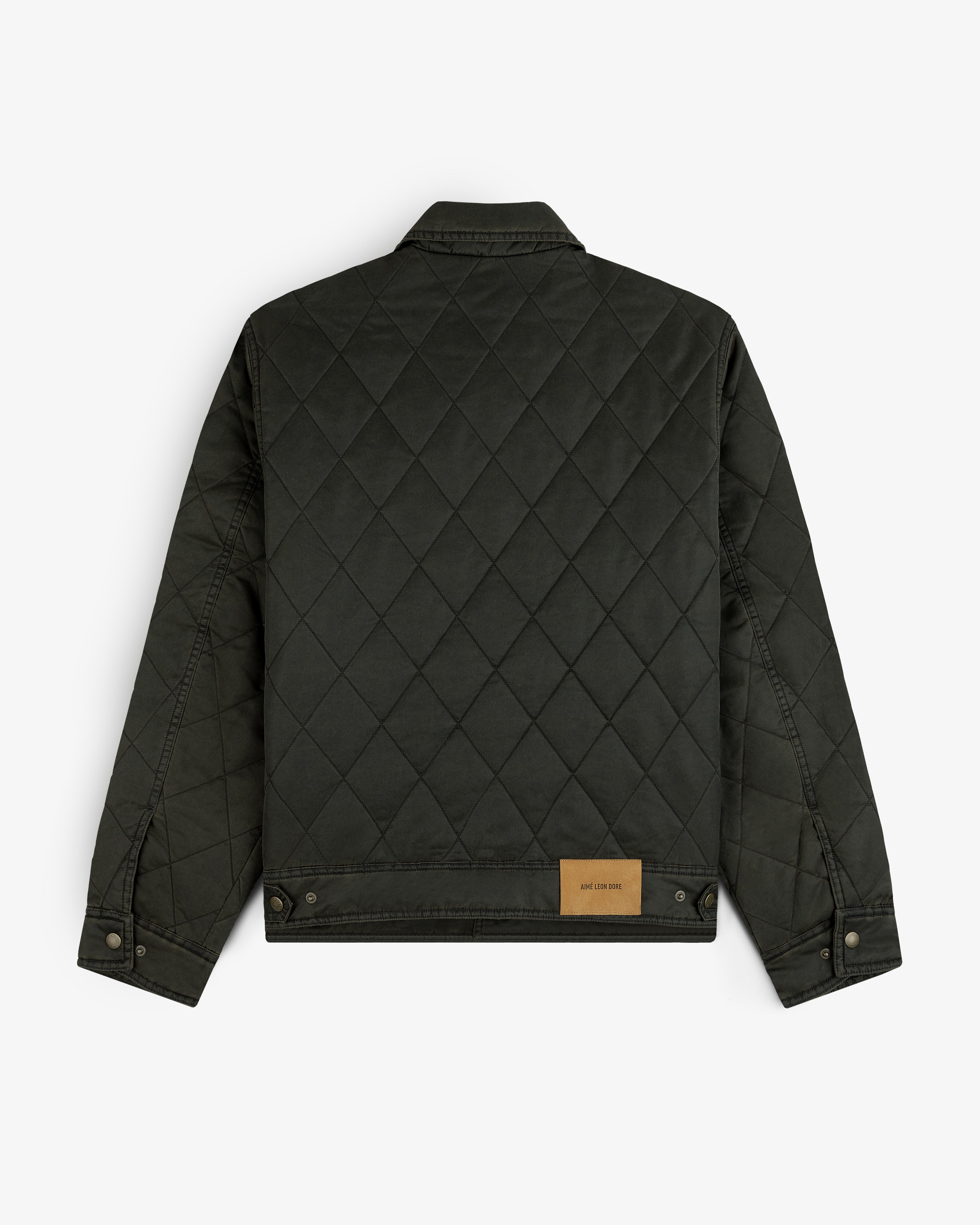 Back view of a dark green Quilted Trucker Jacket with a tan leather patch on the back hem.