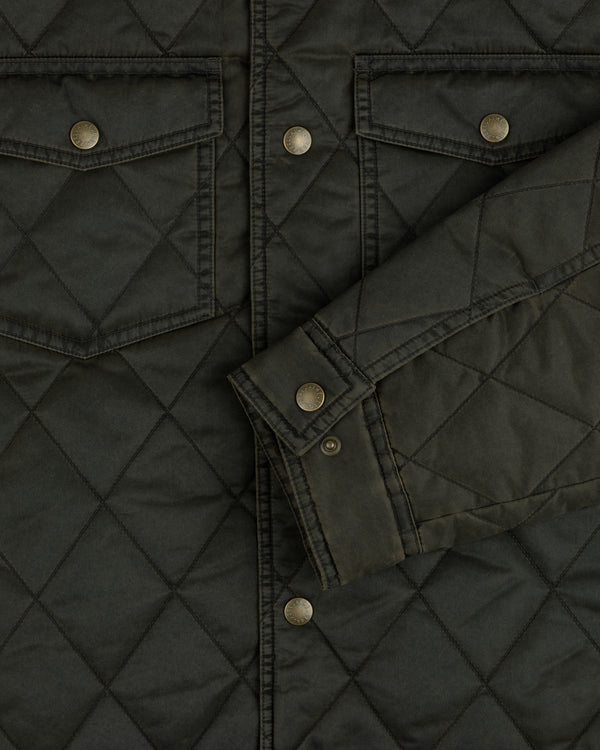 Dark olive quilted Quilted Trucker Jacket with chest pockets, metal buttons, and a buttoned cuff.