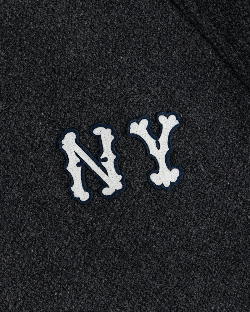 NY Highlanders Wool Varsity Jacket with white NY letters, blue outline on dark textured fabric.