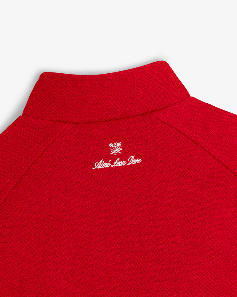 NY Highlanders Wool Varsity Jacket by Aimé Leon Dore with a small white graphic embroidered on the back near the neck.