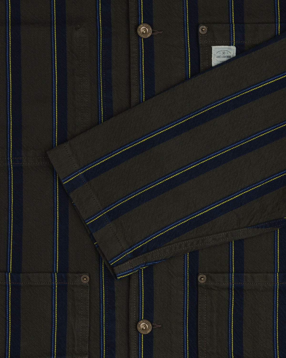 Striped Denim Chore Jacket with blue/yellow stripes, buttons, pockets, and a folded front sleeve.