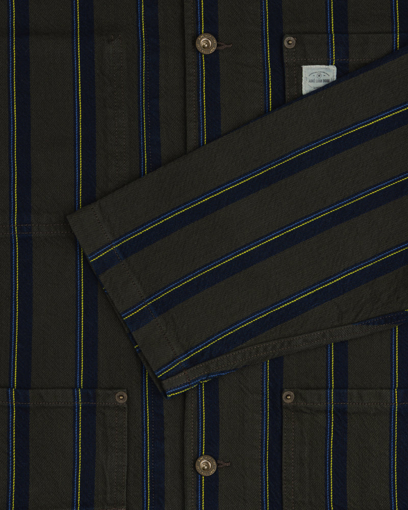Striped Denim Chore Jacket with blue/yellow stripes, buttons, pockets, and a folded front sleeve.