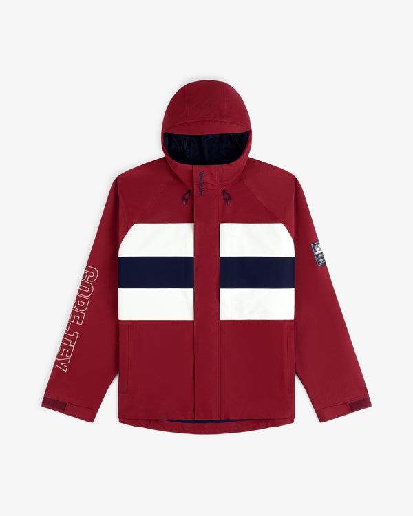 GORE-TEX Striped Sailing Jacket: red hooded with white/navy stripes, sleeve logo, and small arm patch.